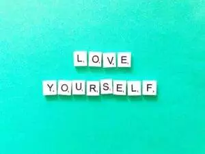 Love Yourself words on green background