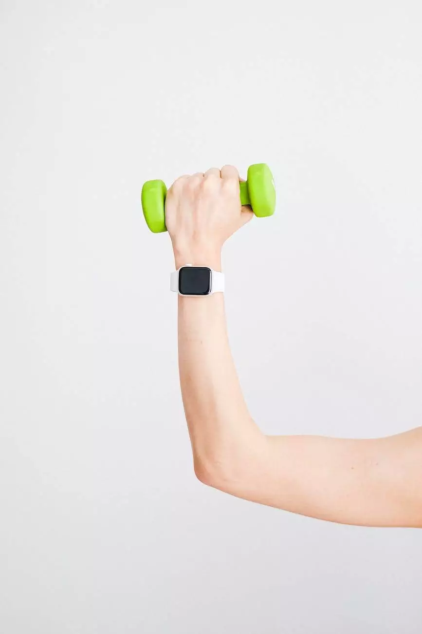 person wearing white apple watch while holding green dumbbell